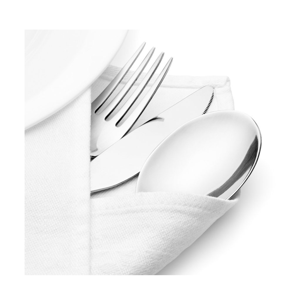 A white plain napkin with cutlery.