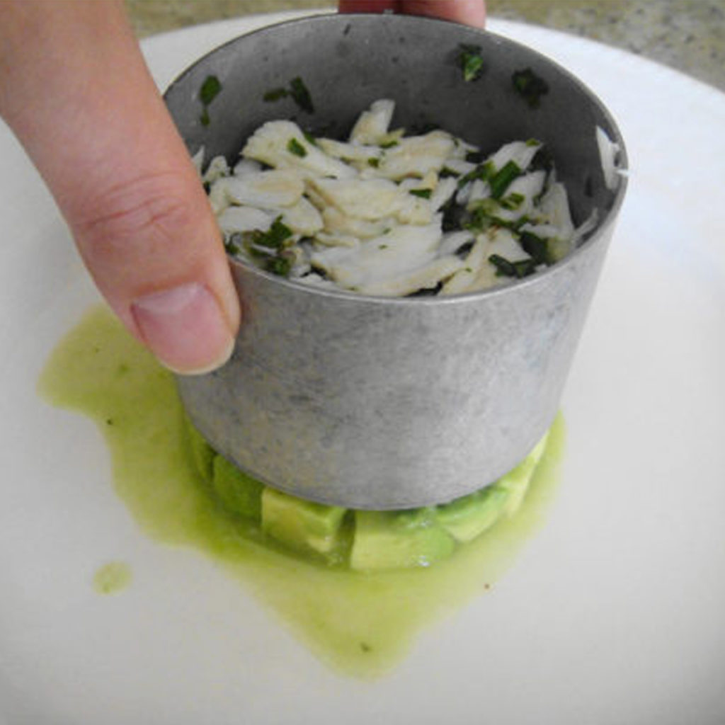 An aluminium food stack ring in use.