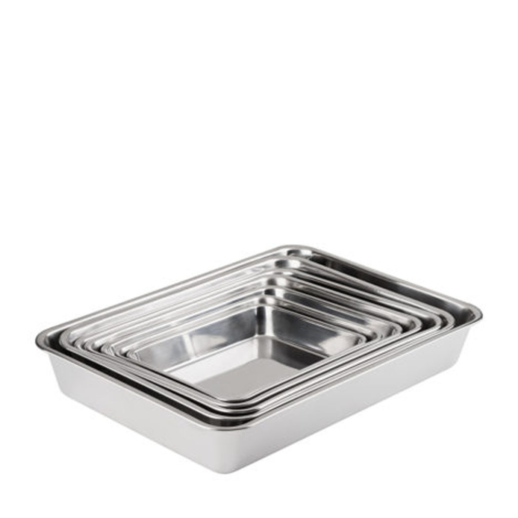 A set of piled up steak and kidney dishes.