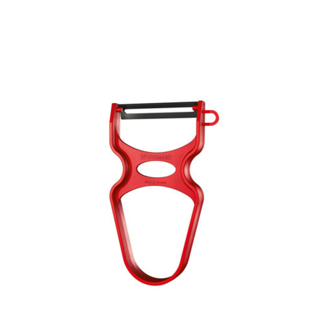 A red Westmark vegetable peeler.