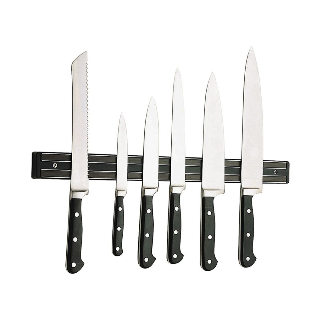 Magnet knife holder with a set of knives mounted.