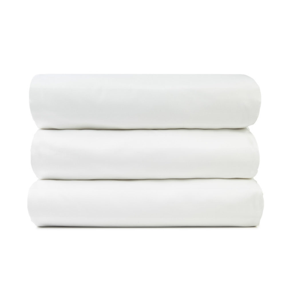 A stack of plain square table cloths.