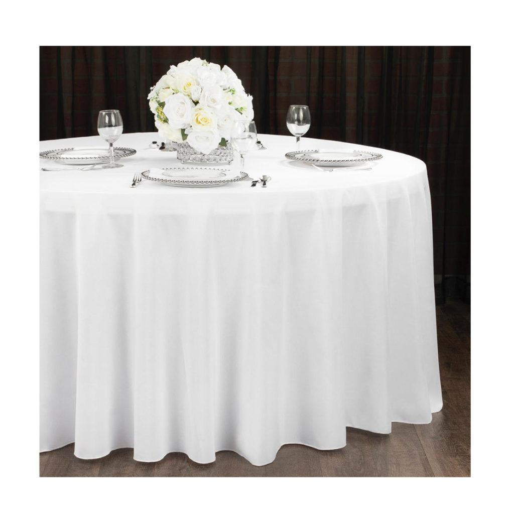 Table setting on a round white table cloth.