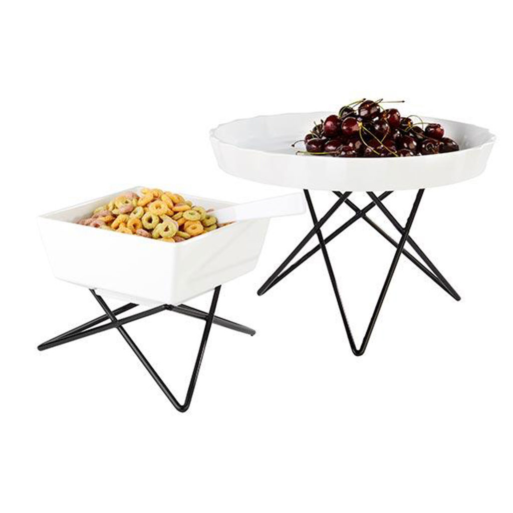 Two prisma buffet stands with dishes on top.