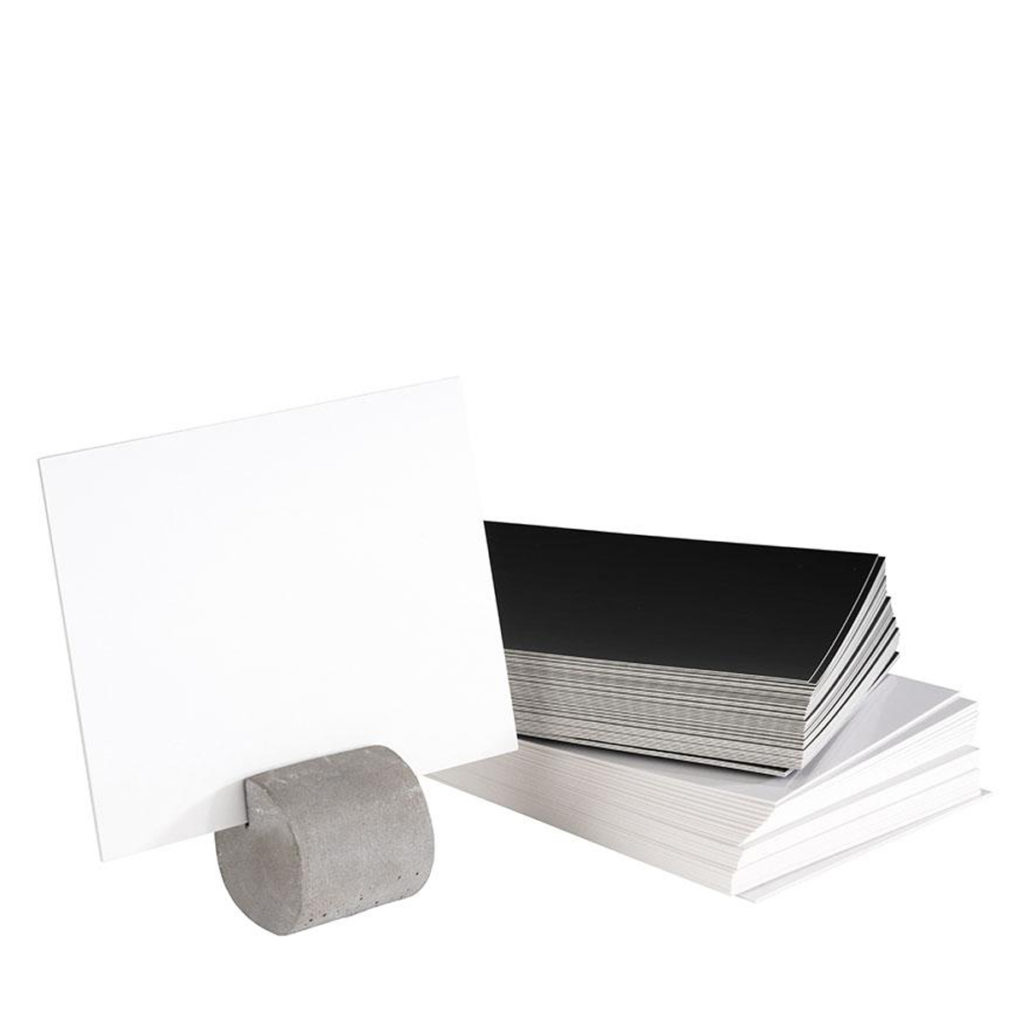 Circular cement menu holder set by APS.