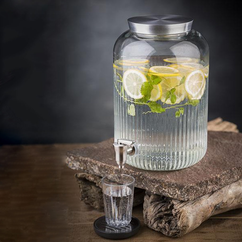 Drinks dispenser with water, herbs and oranges by APS.