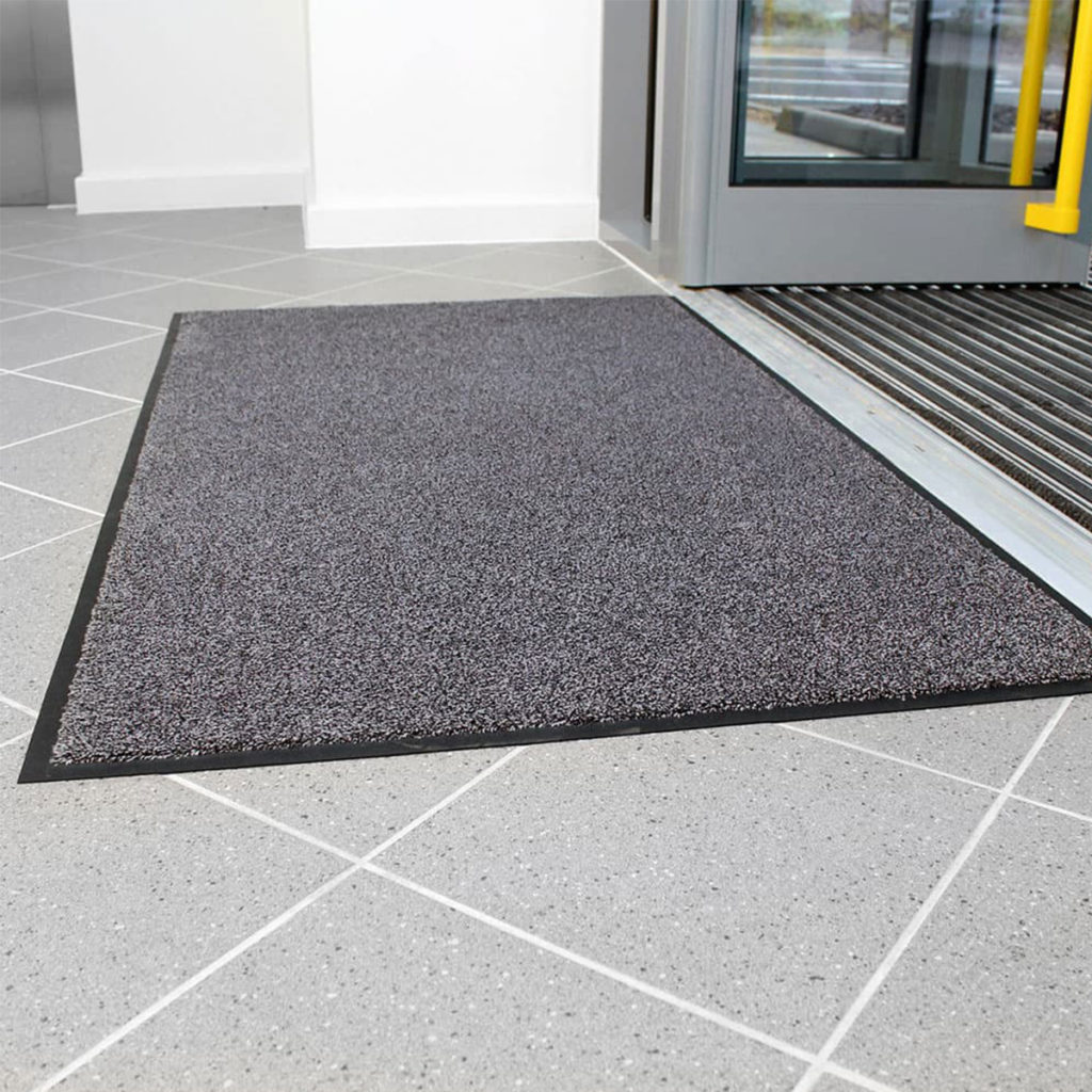A Coba Africa CobaWash floormat in grey, in use.