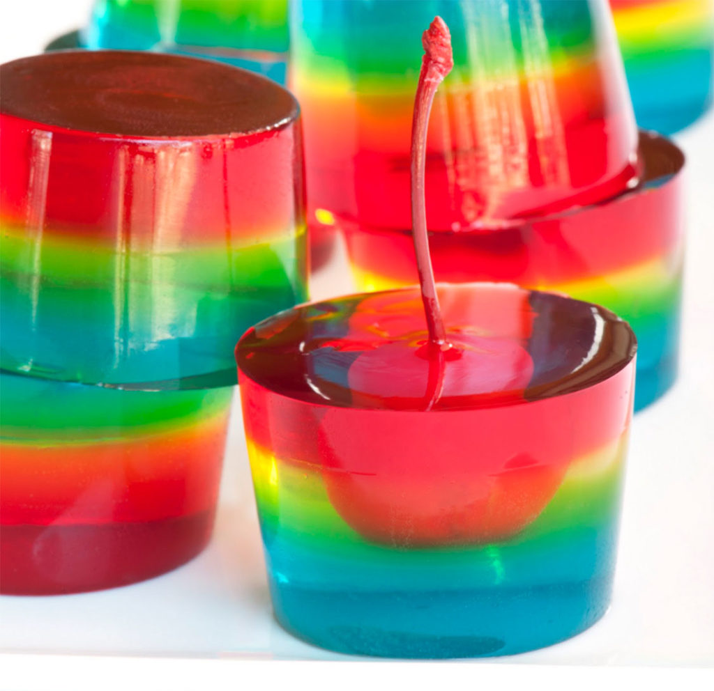 Stunning layered jello shots with cherry centres.